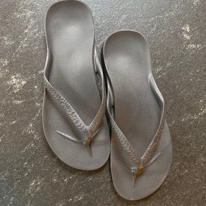 Brand new black Archie flip flops